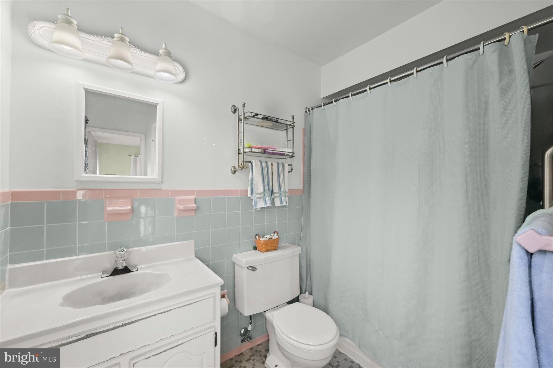 9233 Spring Valley Road Ellicott City, MD 21043 - Photo 18 of 45 a white toilet sitting next to a bathroom sink