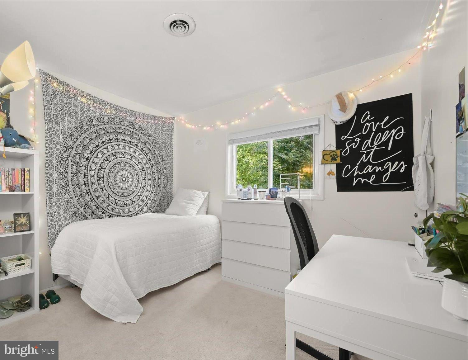 9233 Spring Valley Road Ellicott City, MD 21043 - Photo 19 of 45 a bedroom with a large bed and a couch