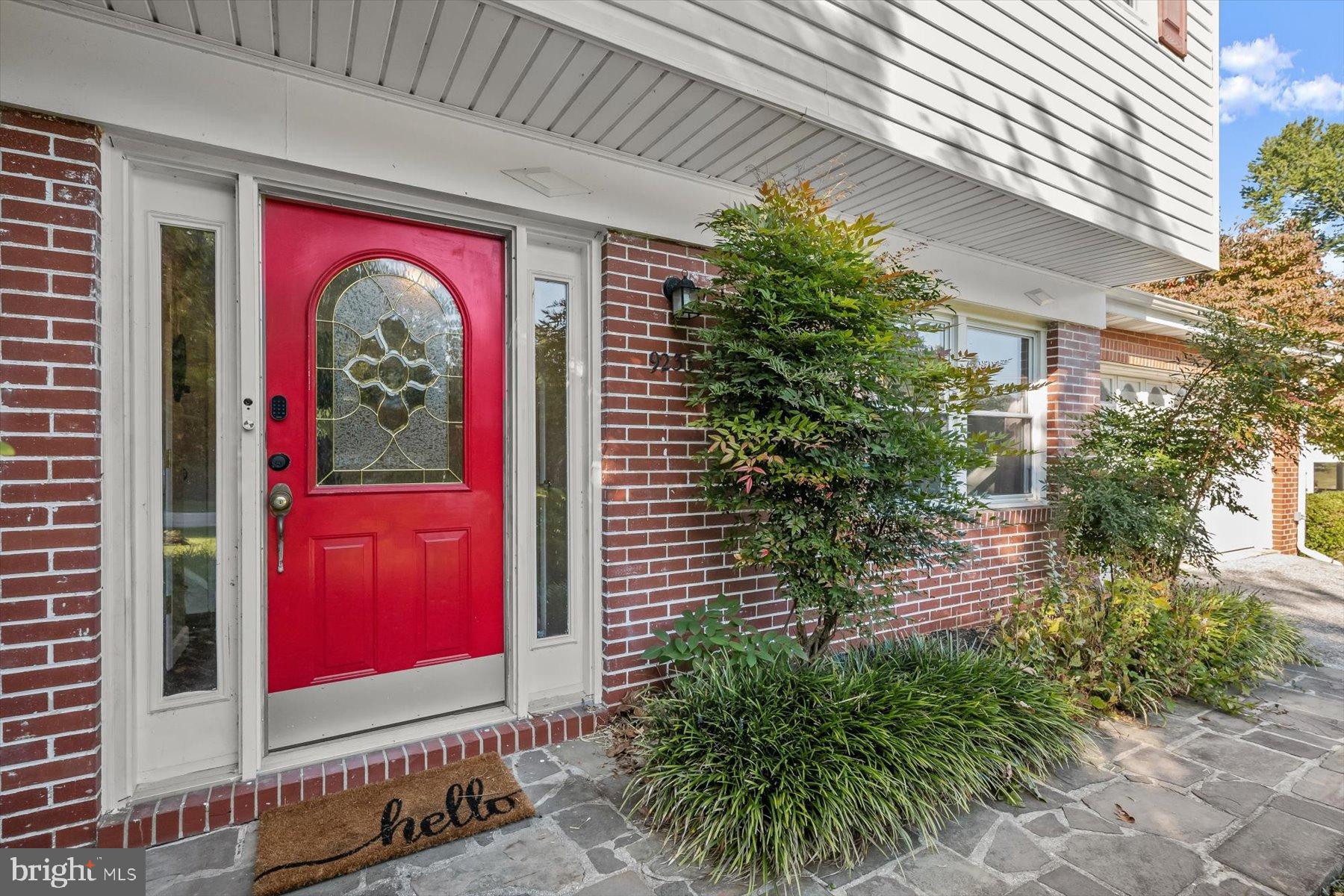 9233 Spring Valley Road Ellicott City, MD 21043 - Photo 2 of 45 a front view of a house with yard