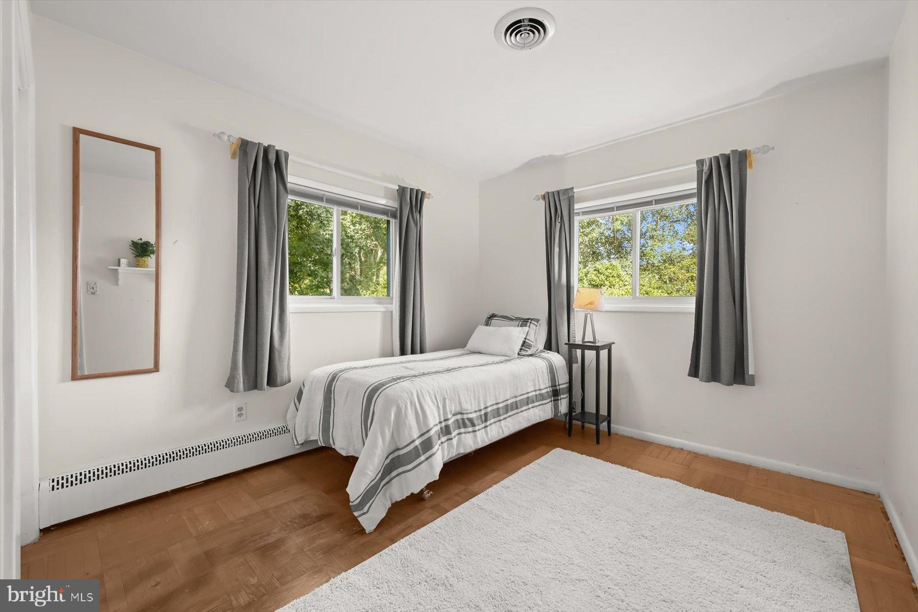 9233 Spring Valley Road Ellicott City, MD 21043 - Photo 21 of 45 a bedroom with a bed and window