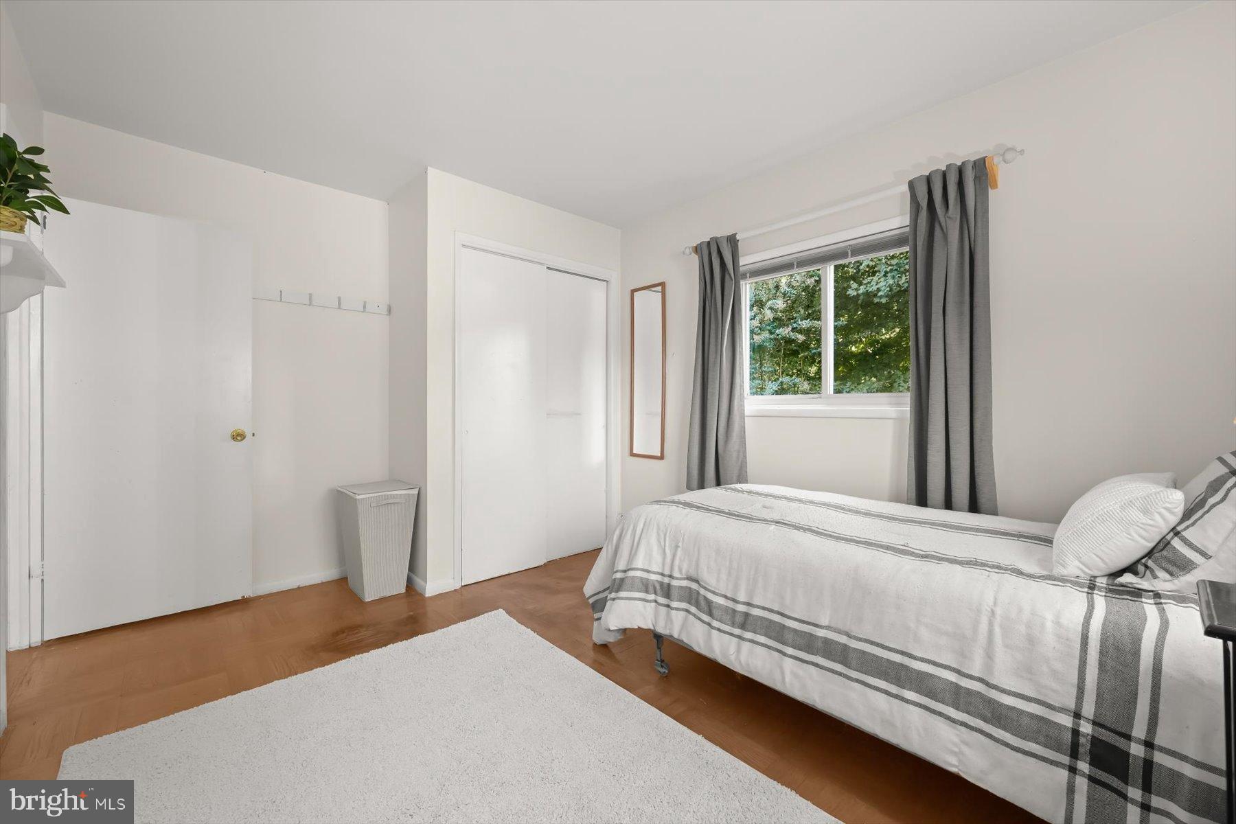 9233 Spring Valley Road Ellicott City, MD 21043 - Photo 22 of 45 a bedroom with a bed and a window