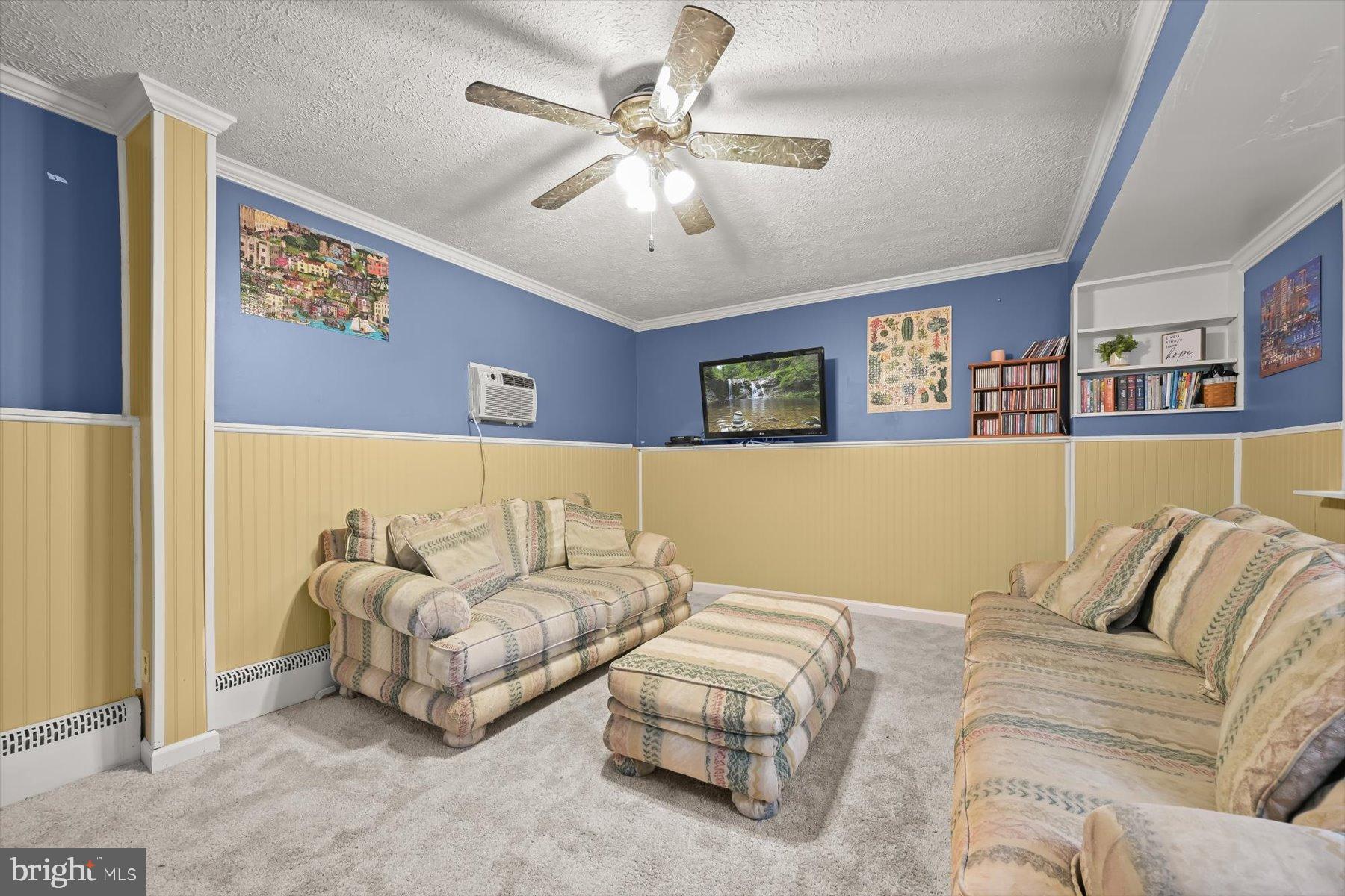 9233 Spring Valley Road Ellicott City, MD 21043 - Photo 25 of 45 a living room with furniture and a night stand