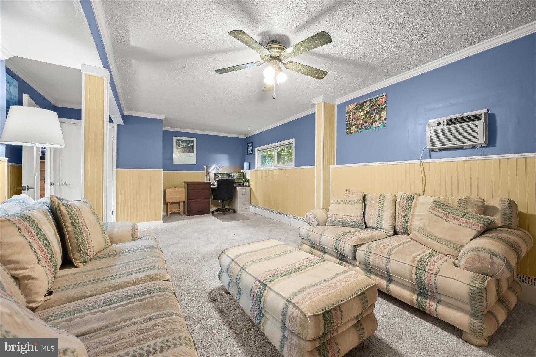 9233 Spring Valley Road Ellicott City, MD 21043 - Photo 26 of 45 a living room with furniture and a ceiling fan
