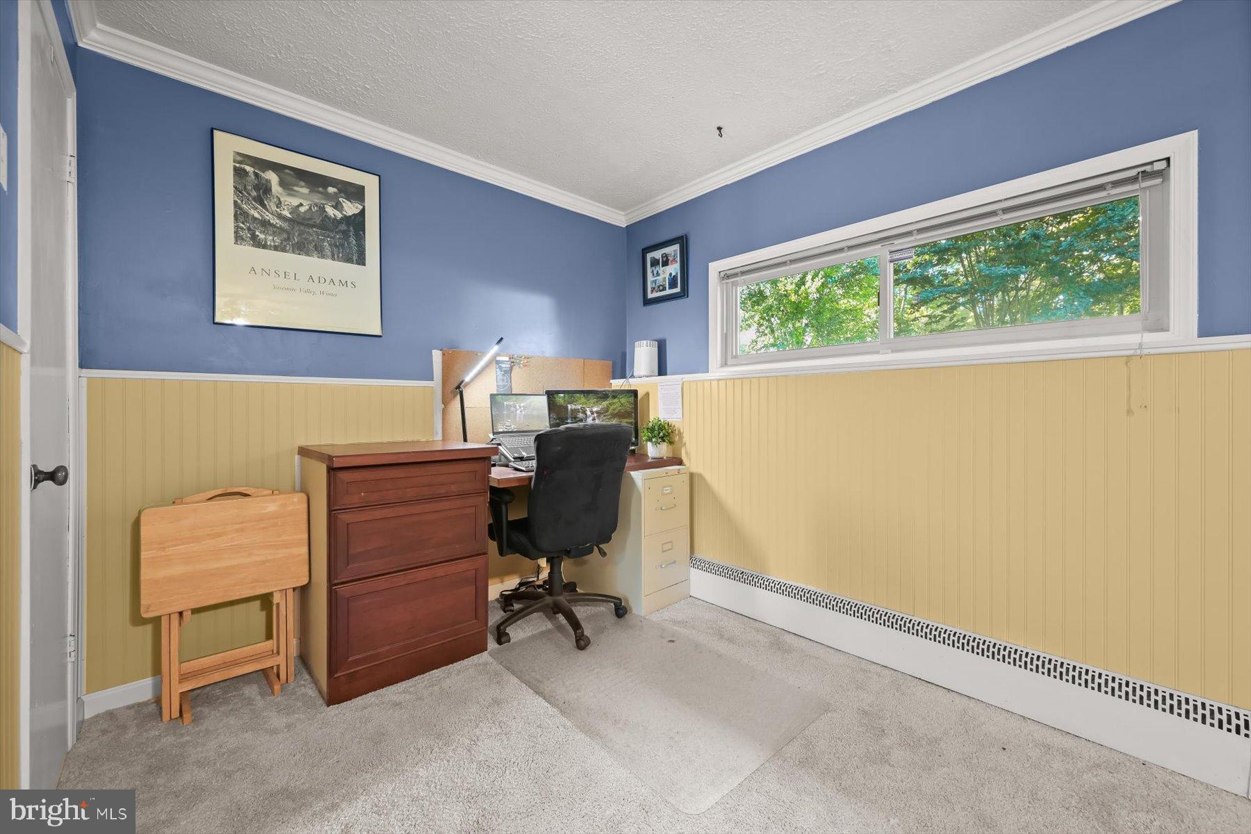 9233 Spring Valley Road Ellicott City, MD 21043 - Photo 27 of 45 a view of a workspace with furniture and a window