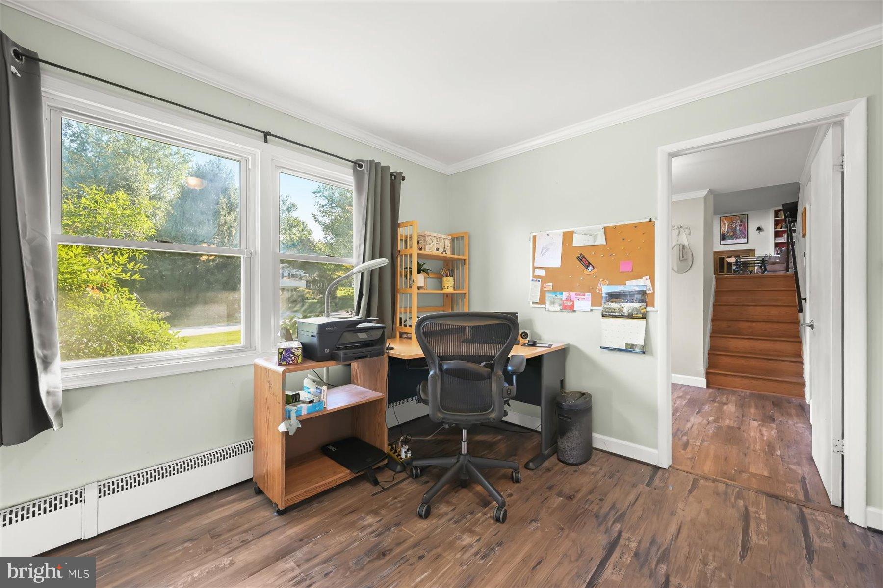 9233 Spring Valley Road Ellicott City, MD 21043 - Photo 28 of 45 a work room with furniture and wooden floor