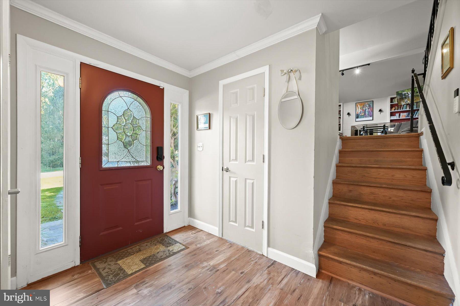9233 Spring Valley Road Ellicott City, MD 21043 - Photo 3 of 45 a view of entryway with wooden floor mirror and a window