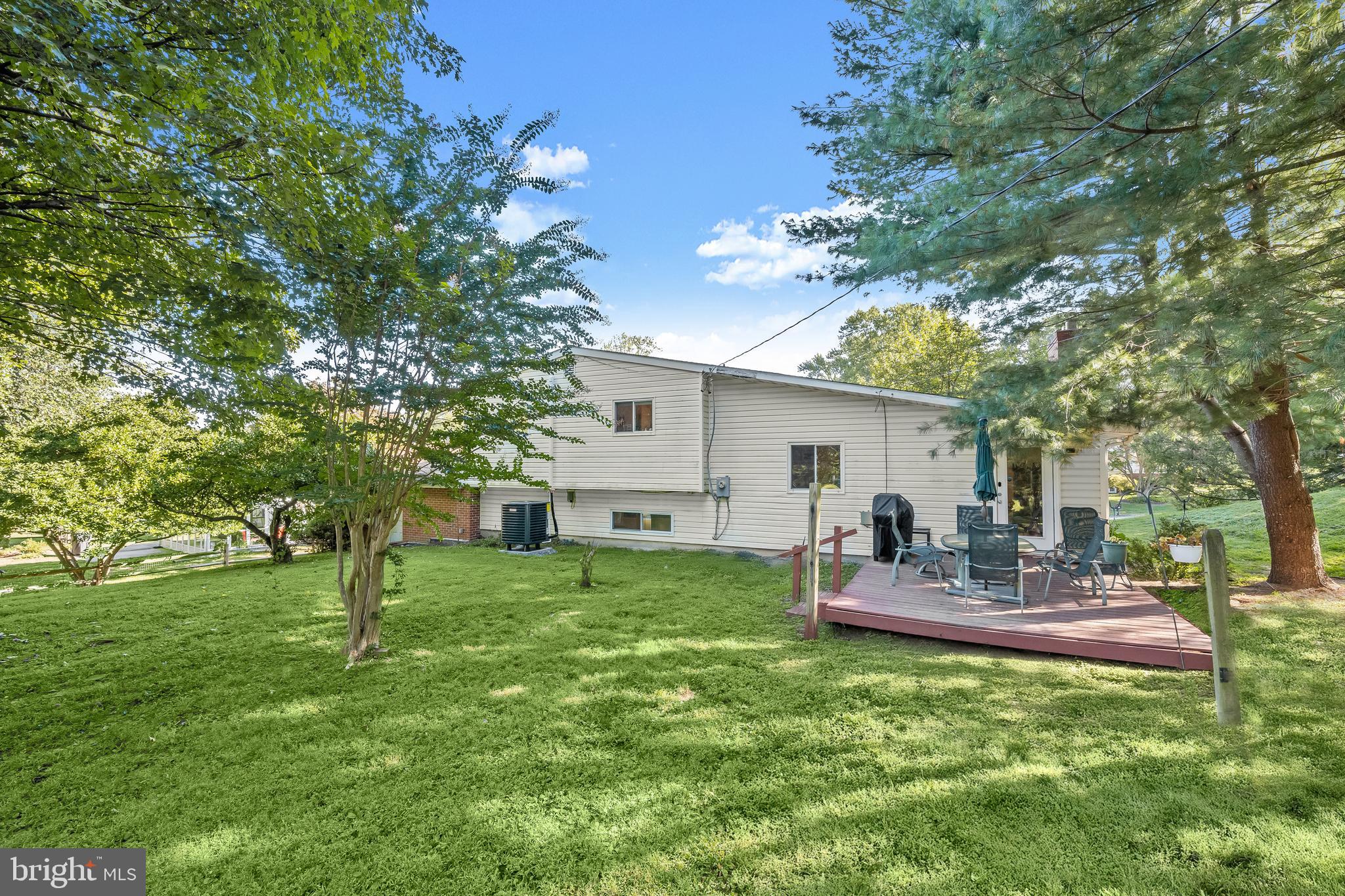 9233 Spring Valley Road Ellicott City, MD 21043 - Photo 35 of 45 a backyard of a house with table and chairs
