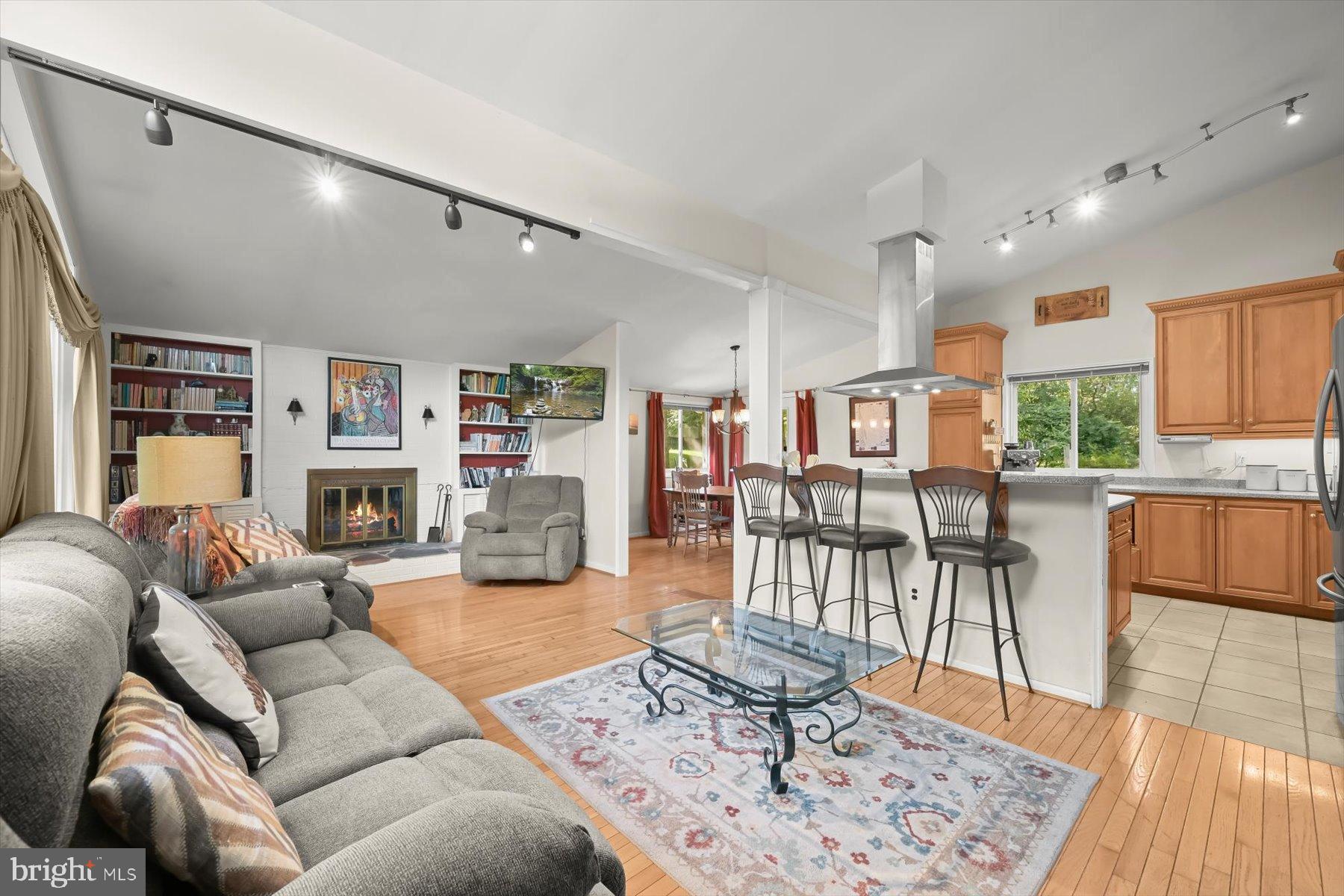 9233 Spring Valley Road Ellicott City, MD 21043 - Photo 44 of 45 a living room with furniture and a wooden floor