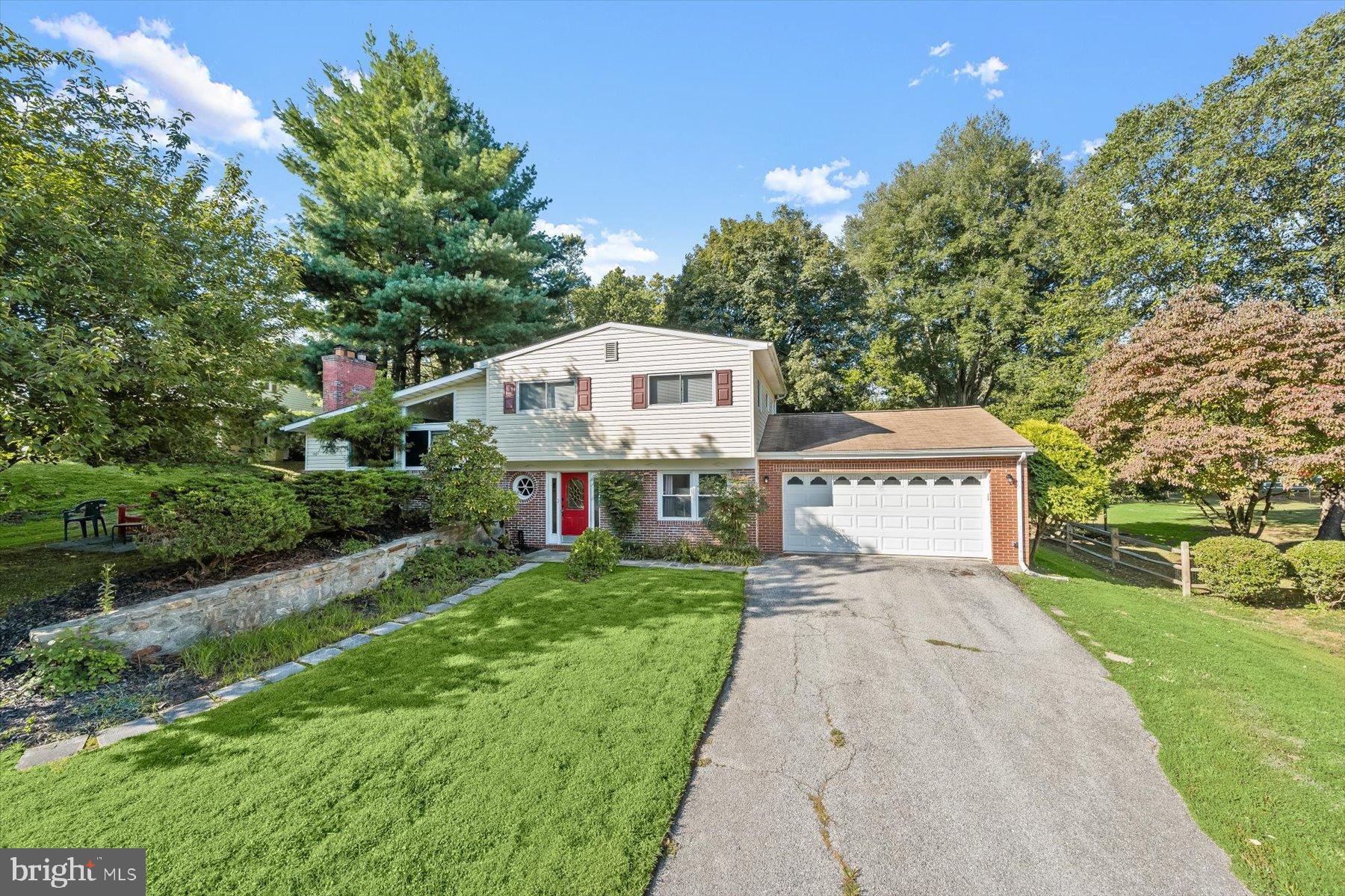 9233 Spring Valley Road Ellicott City, MD 21043 - Photo 40 of 45 a white house that has tree in front of it
