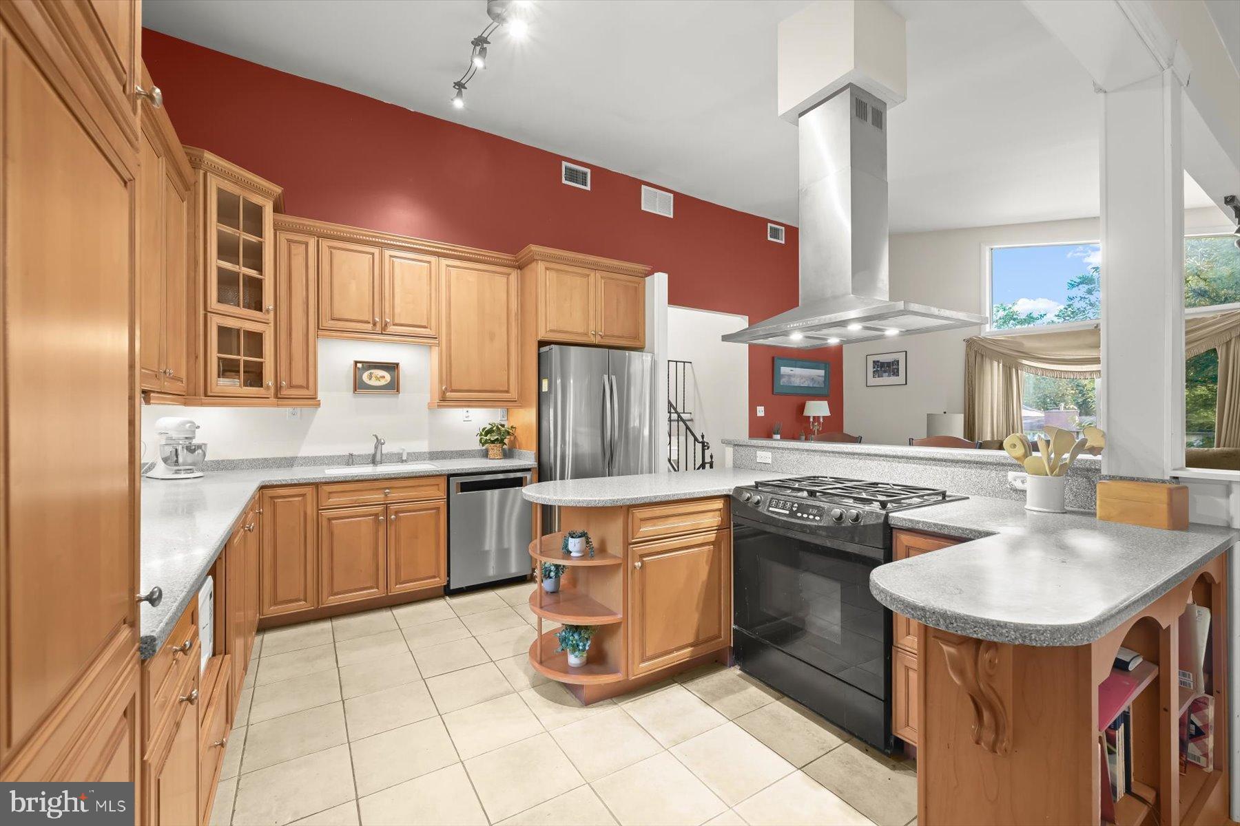 9233 Spring Valley Road Ellicott City, MD 21043 - Photo 5 of 45 a kitchen with stainless steel appliances granite countertop a sink stove and refrigerator