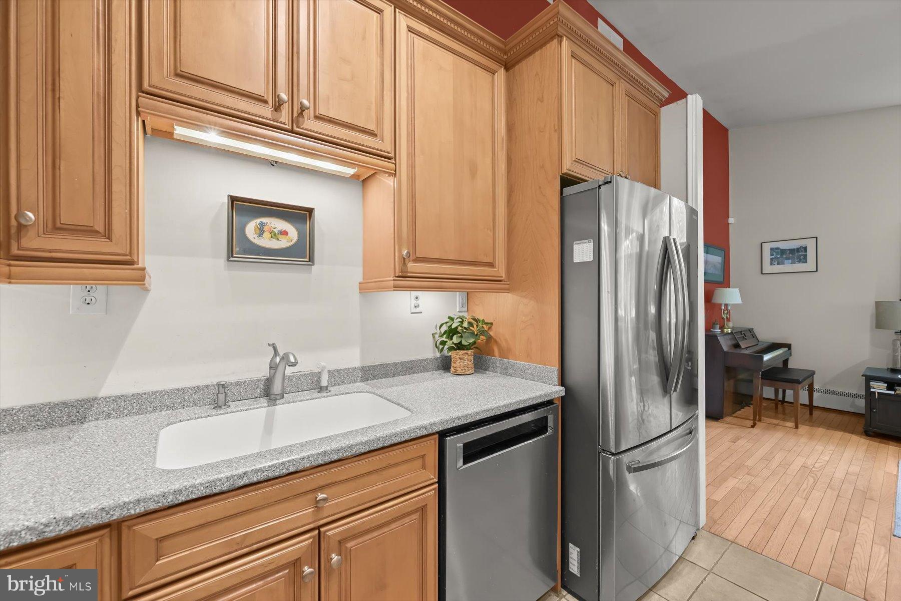 9233 Spring Valley Road Ellicott City, MD 21043 - Photo 7 of 45 a kitchen with stainless steel appliances granite countertop a refrigerator and a sink