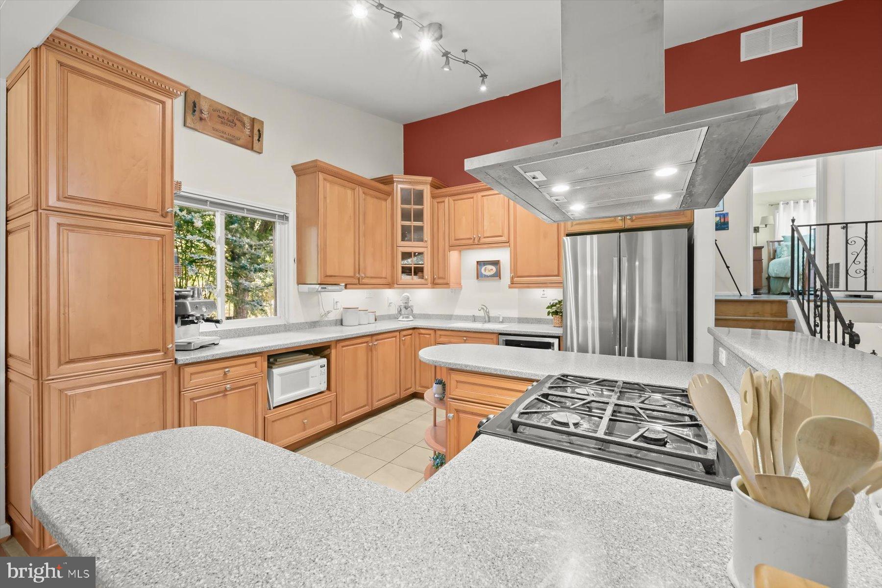 9233 Spring Valley Road Ellicott City, MD 21043 - Photo 8 of 45 a kitchen with stainless steel appliances granite countertop a sink stove and refrigerator