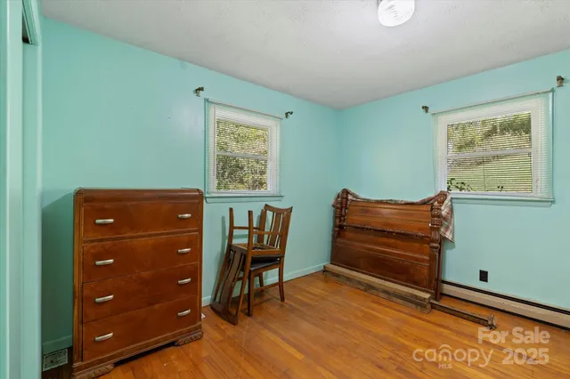 a room with furniture and wooden floor