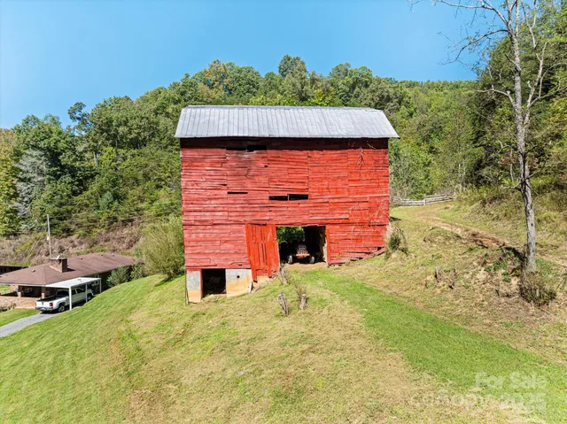 a yellow house with trees in front of it