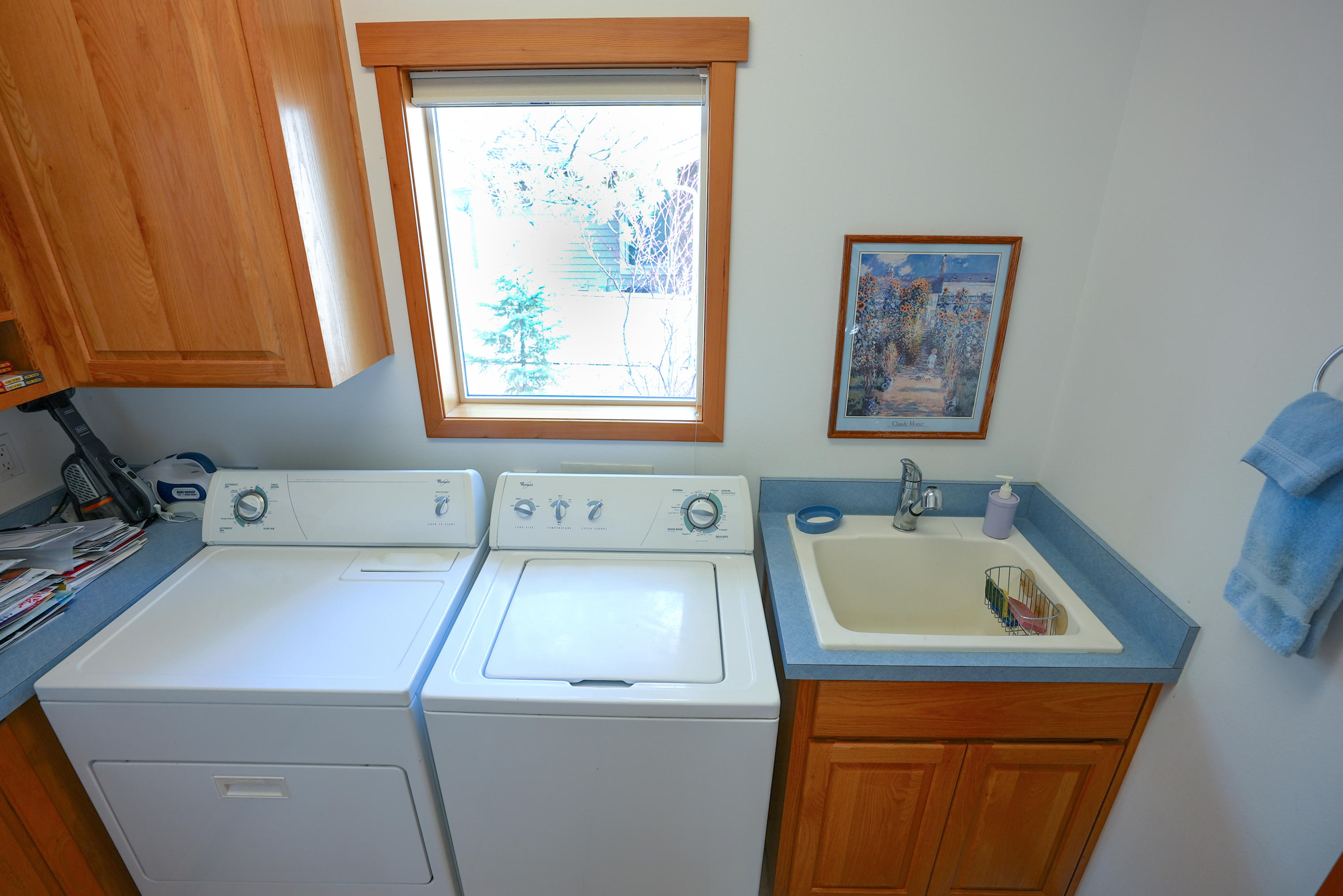 60709 Golf Village Loop Bend, OR 97702 - Photo 32 of 45 Utility room with deep sink and washer dryer, lots of storage cabinets too