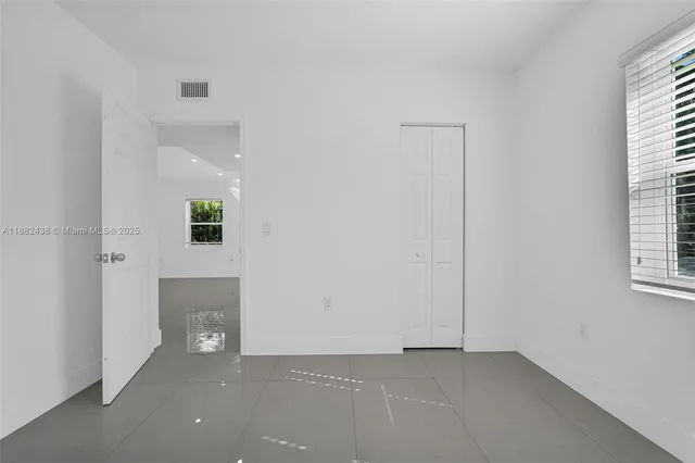 an empty room with windows