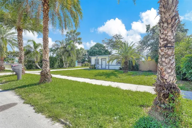a view of a backyard with a garden and plants