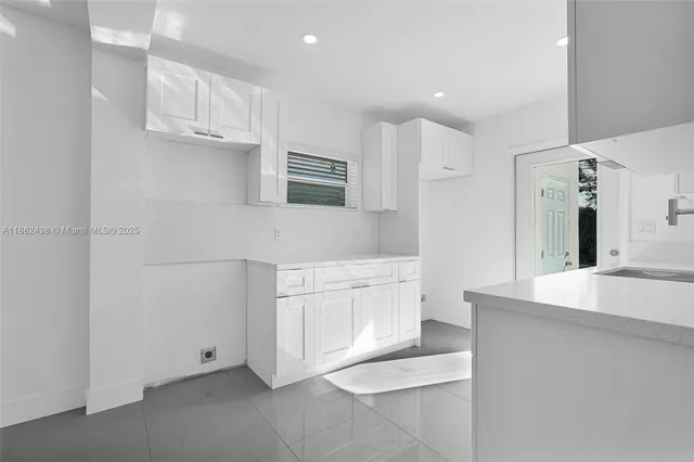 a view of a kitchen with electric appliances