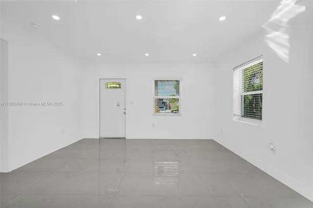 an empty room with windows