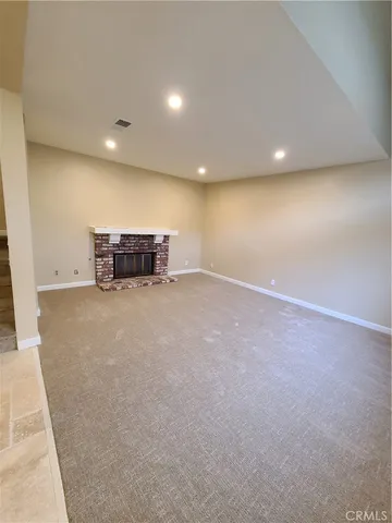 a view of an empty room with a balcony
