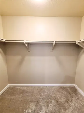 a bathroom with a double vanity sink mirror and shower