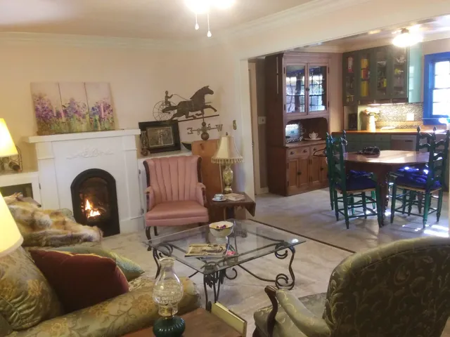 a bathroom with a sink and mirror with bathtub