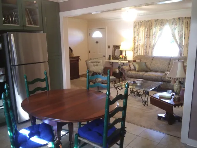 a backyard of a house with outdoor seating