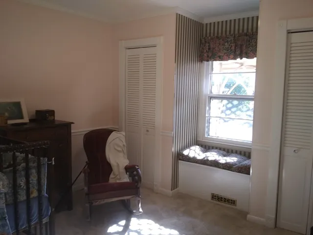 a view of a dining room with furniture and window