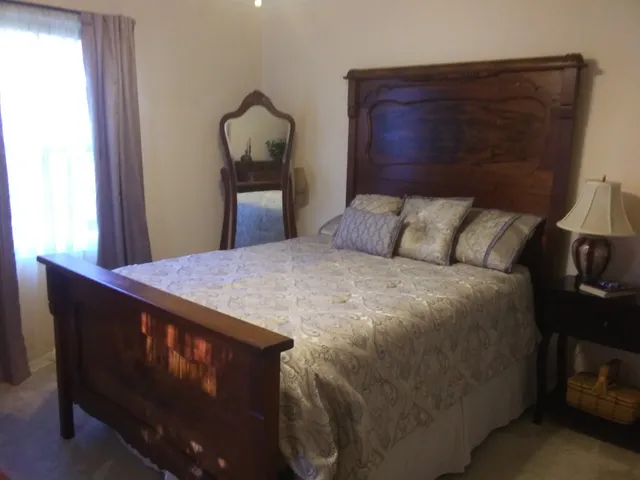 an entryway with wooden floor and windows