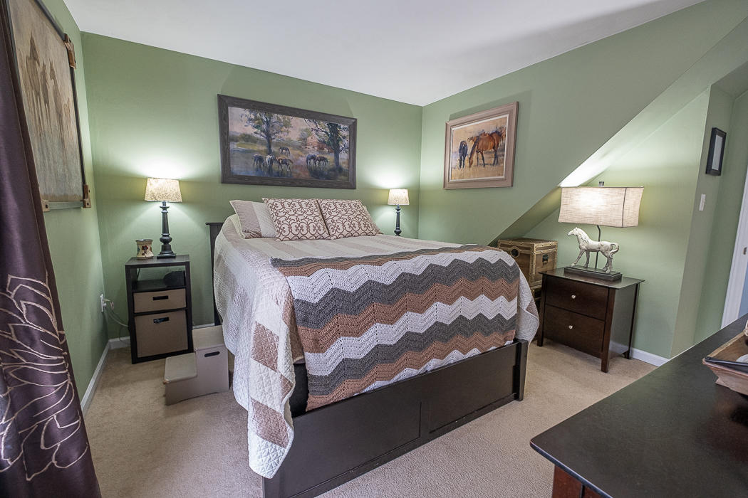 3327 Forest Ridge Road Roanoke, VA 24018 - Photo 15 of 31 a bedroom with a bed and a lamp on dresser