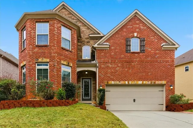 front view of a house with a yard
