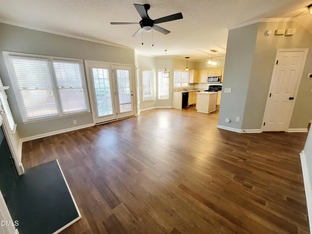 a stove top oven sitting inside of a kitchen