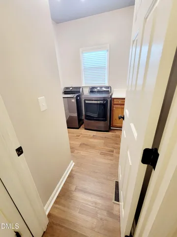 a bathroom with a toilet sink and a mirror