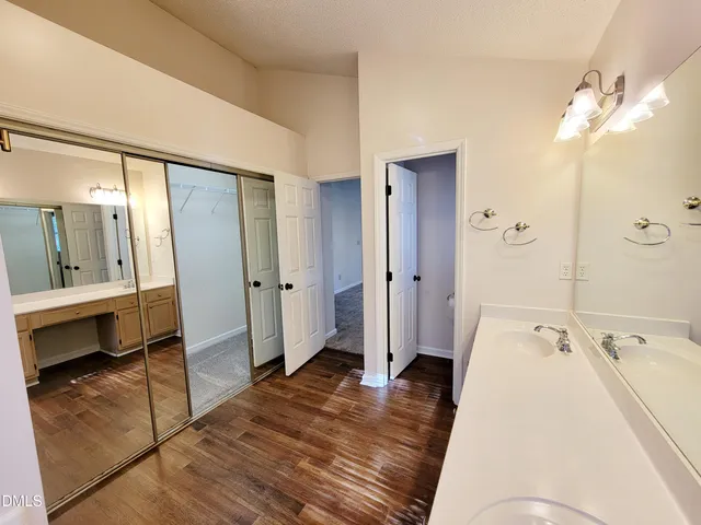 a bathroom with a bathtub shower sink and toilet