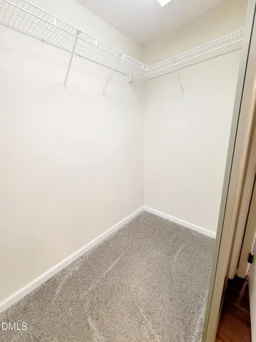 an empty room with windows and entrance