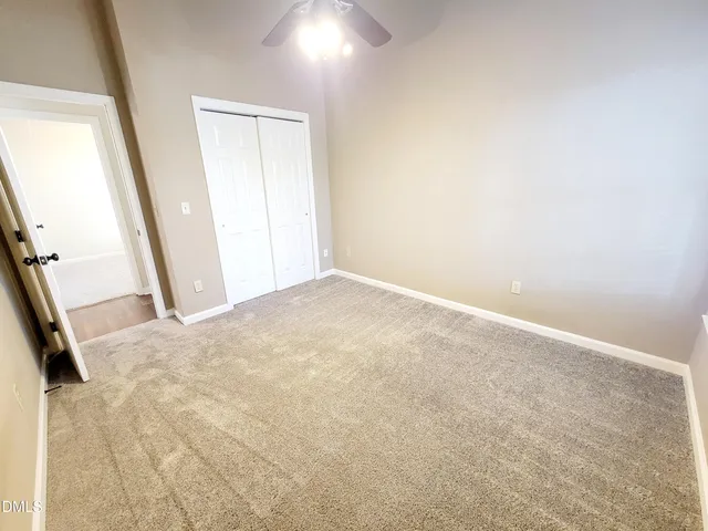 a view of a house with deck and wooden floor