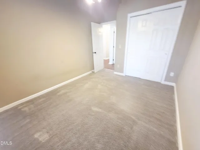 a view of a house with a yard covered in snow