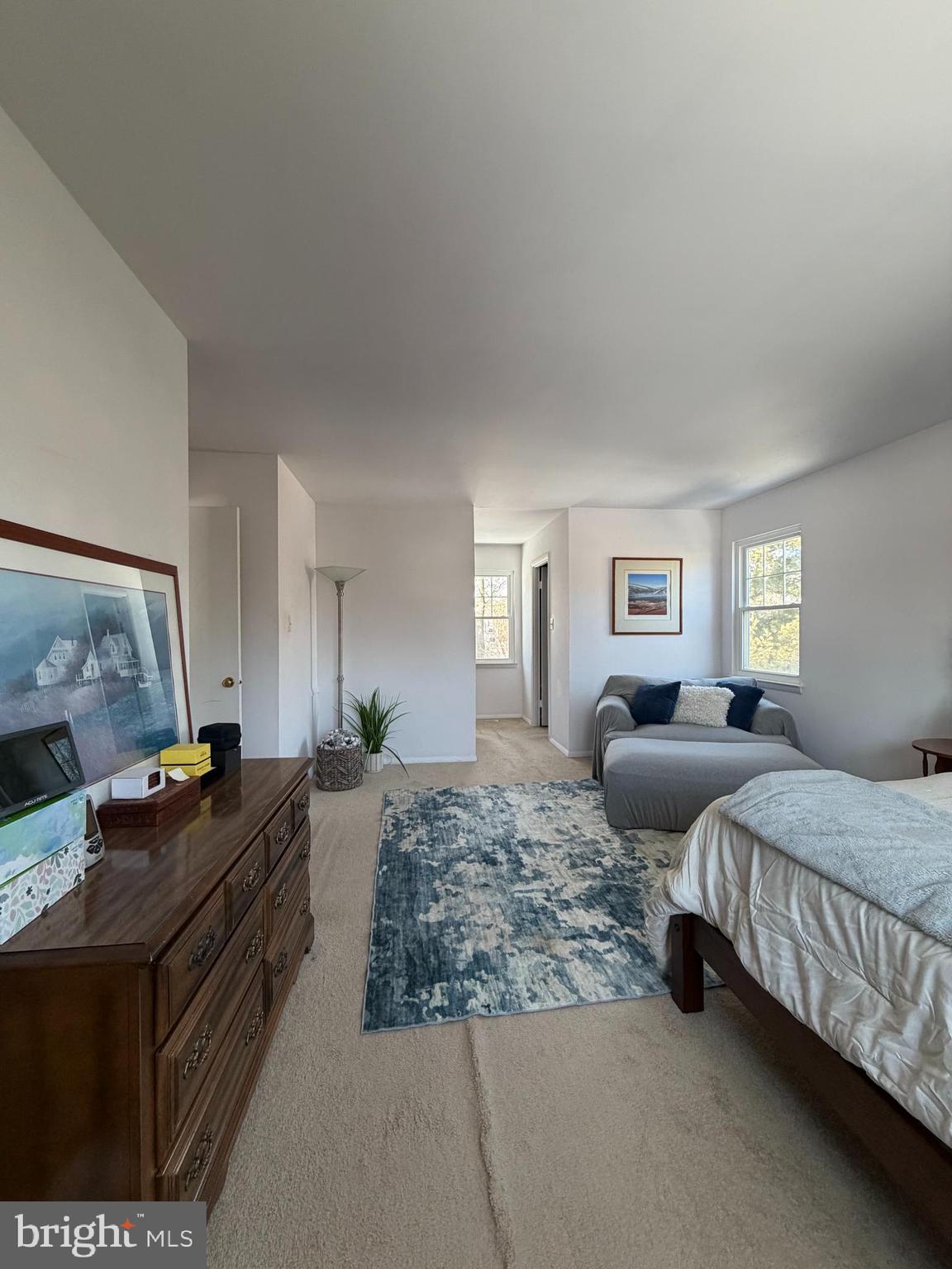 18812 Jade Court Gaithersburg, MD 20879 - Photo 15 of 32 a bedroom with two beds and a chandelier