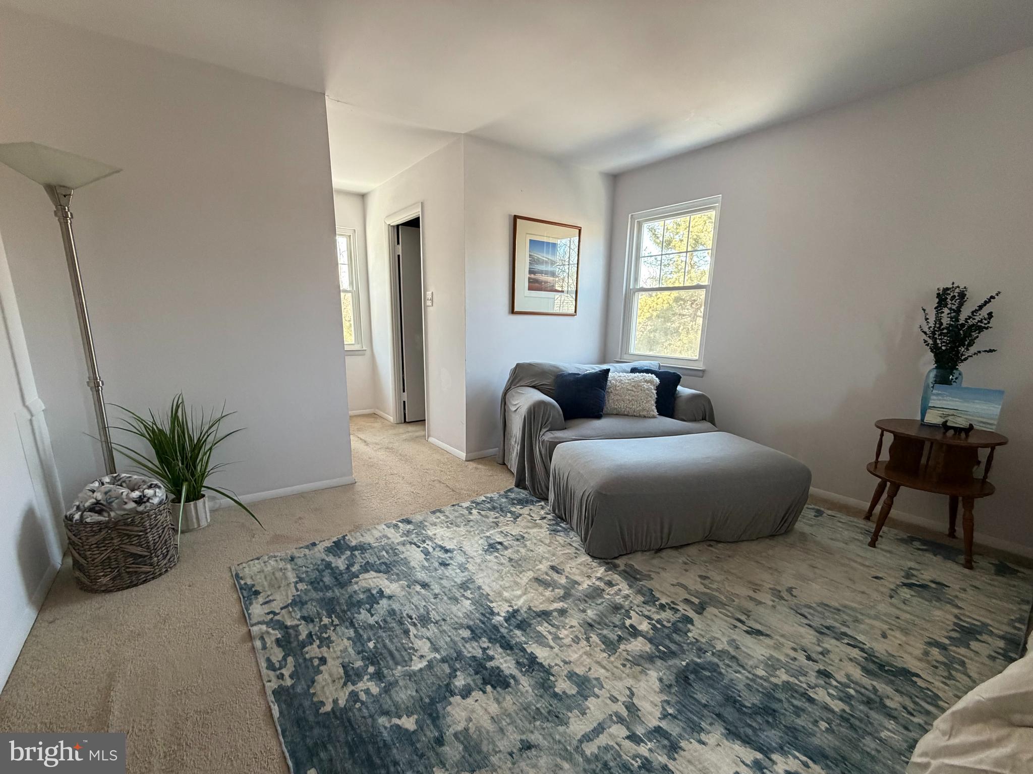 18812 Jade Court Gaithersburg, MD 20879 - Photo 16 of 32 a bedroom with a large bed and potted plant
