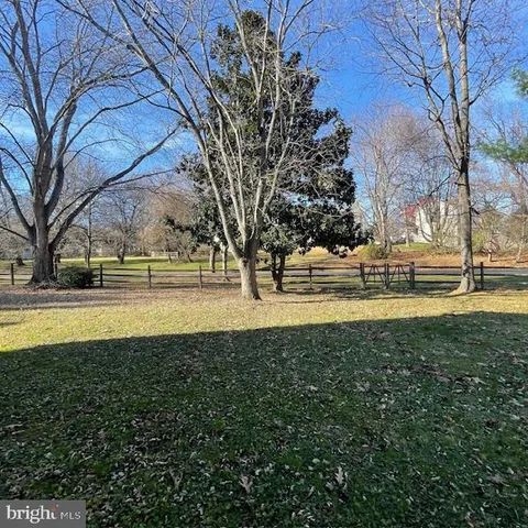 a view of swimming pool with outdoor seating and yard