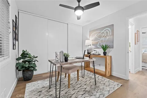 a bedroom with a bed and cabinets