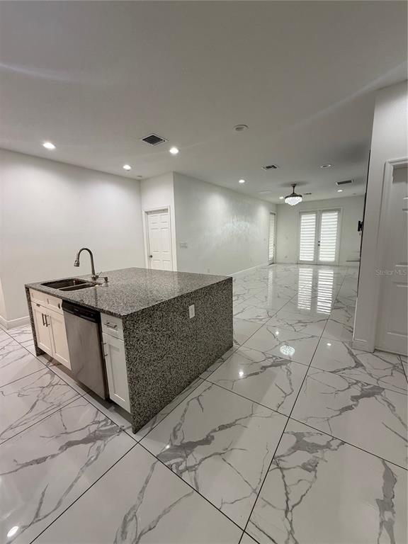 310 Grape Avenue St. Cloud, FL 34769 - Photo 11 of 27 a large room with a large mirror and cabinets