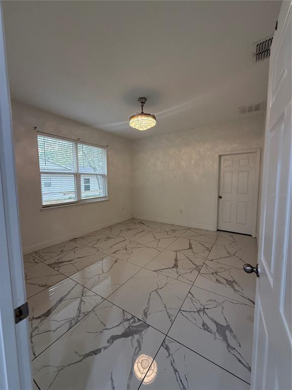 310 Grape Avenue St. Cloud, FL 34769 - Photo 18 of 27 an empty room with windows