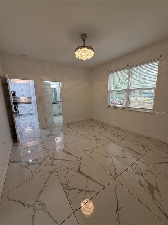 310 Grape Avenue St. Cloud, FL 34769 - Photo 20 of 27 a view of a livingroom with a window