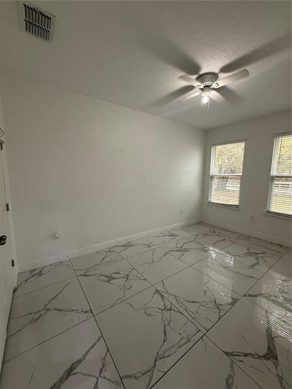 310 Grape Avenue St. Cloud, FL 34769 - Photo 24 of 27 a view of an empty room and window