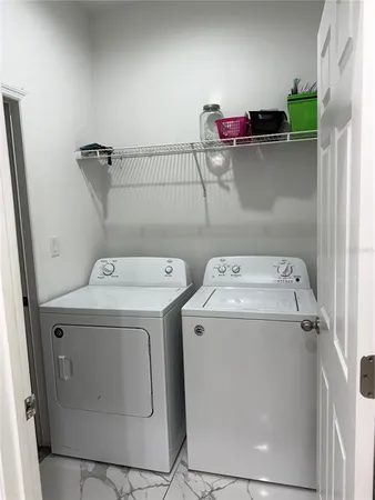 a utility room with dryer and washer