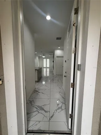 a bathroom with a glass shower door