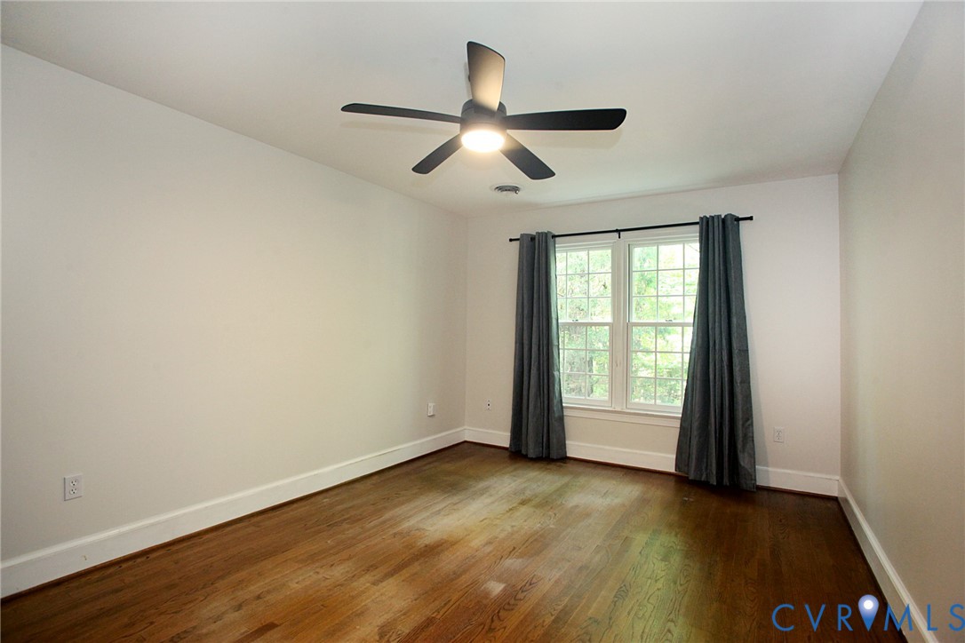 231 Hazelmere Drive Chesterfield, VA 23236 - Photo 22 of 33 an empty room with wooden floor and windows