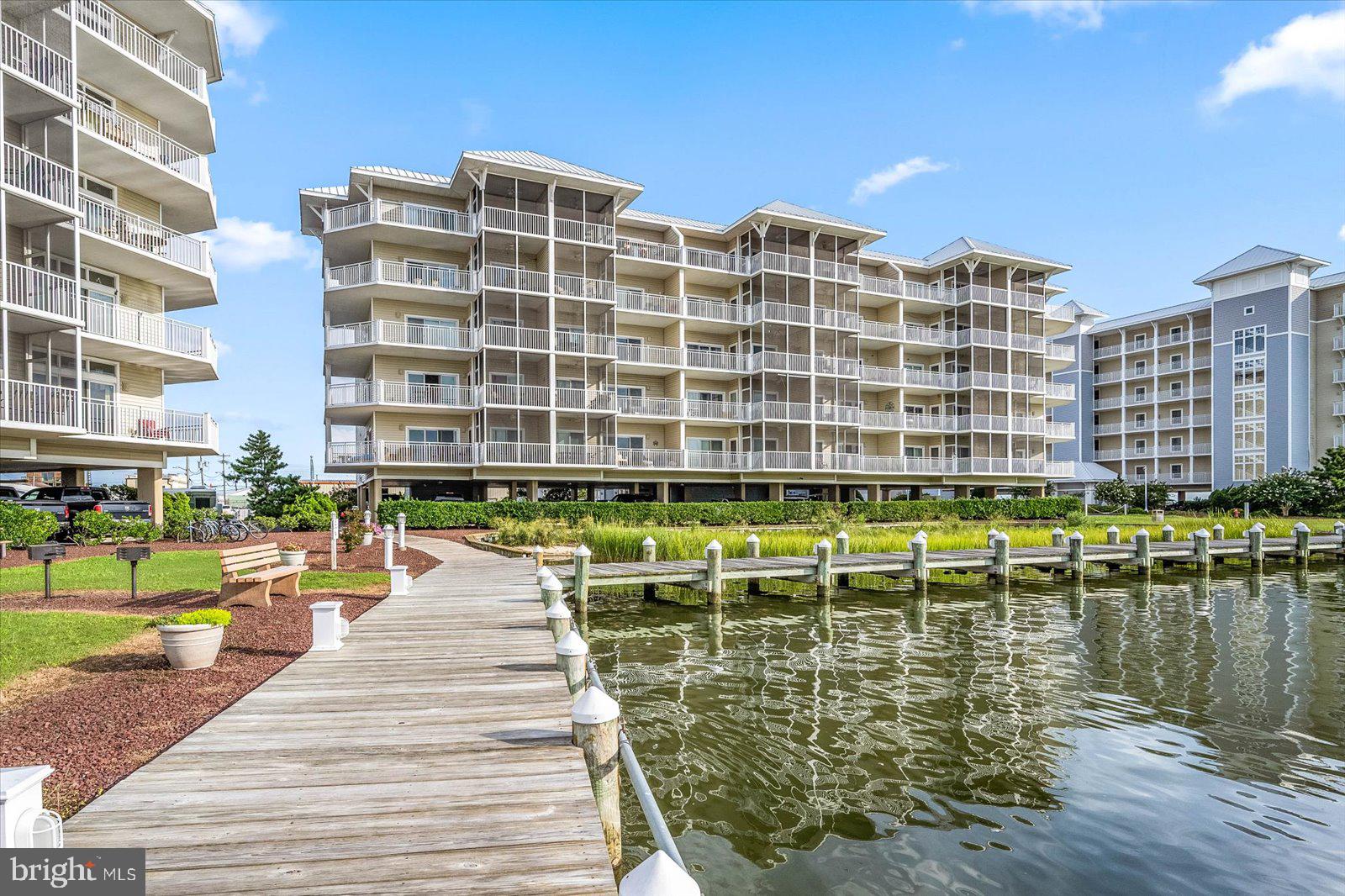102 Williams Street, Unit 311 Crisfield, MD 21817 - Photo 1 of 57 a view of a swimming pool with a lounge chairs