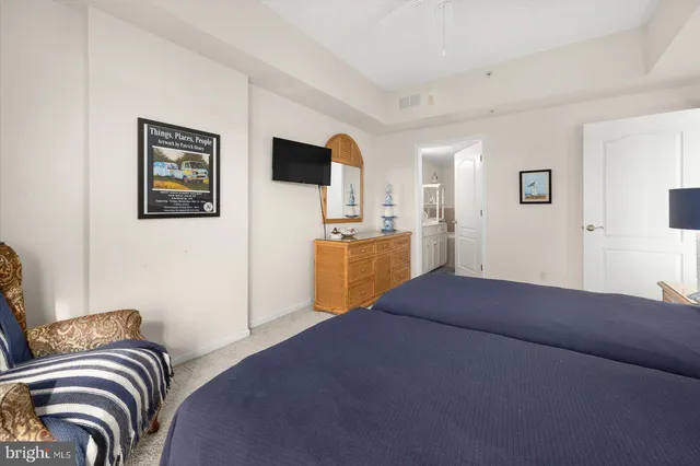 a view of a hallway with paintings on the wall